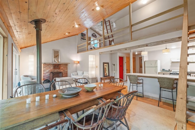 30 Hallenbach Rd, Glen Spey, NY 12737 - dining area featuring a fireplace, light wood finished floors, wood ceiling, and high vaulted ceiling