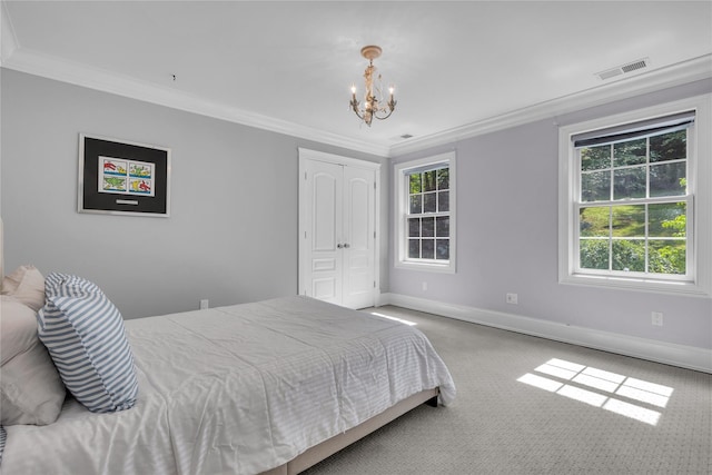 299 Barger St, Putnam Valley, NY 10579 - carpeted bedroom featuring a chandelier, crown molding, and a closet