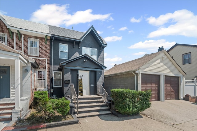 13015 Sutter Ave, South Ozone Park, NY 11420 - view of front facade featuring brick siding and a garage