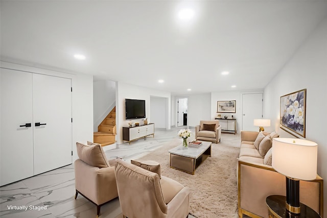 13015 Sutter Ave, South Ozone Park, NY 11420 - living room with recessed lighting, light marble finish flooring, and stairs
