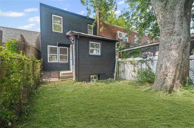 13015 Sutter Ave, South Ozone Park, NY 11420 - rear view of house with a chimney