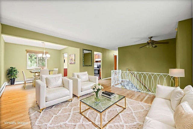 1291 Minerva Ave, West Islip, NY 11795 - living area featuring a chandelier, wood finished floors, and ceiling fan