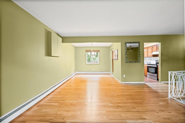 1291 Minerva Ave, West Islip, NY 11795 - unfurnished room with a baseboard heating unit, light wood-type flooring, and a baseboard radiator