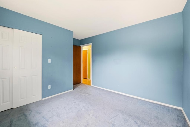 1291 Minerva Ave, West Islip, NY 11795 - unfurnished bedroom featuring carpet flooring and a closet