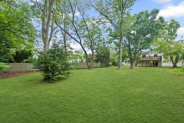 1291 Minerva Ave, West Islip, NY 11795 - fenced backyard featuring a deck