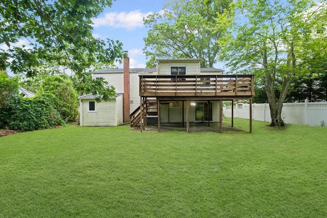 1291 Minerva Ave, West Islip, NY 11795 - back of property with a deck, stairs, and a chimney