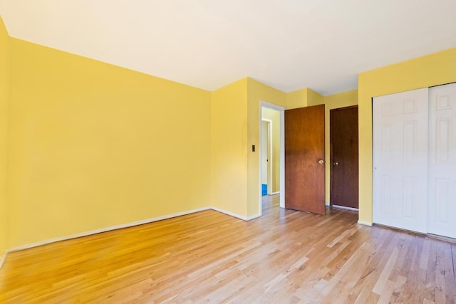 1291 Minerva Ave, West Islip, NY 11795 - unfurnished bedroom featuring light wood-type flooring and a closet