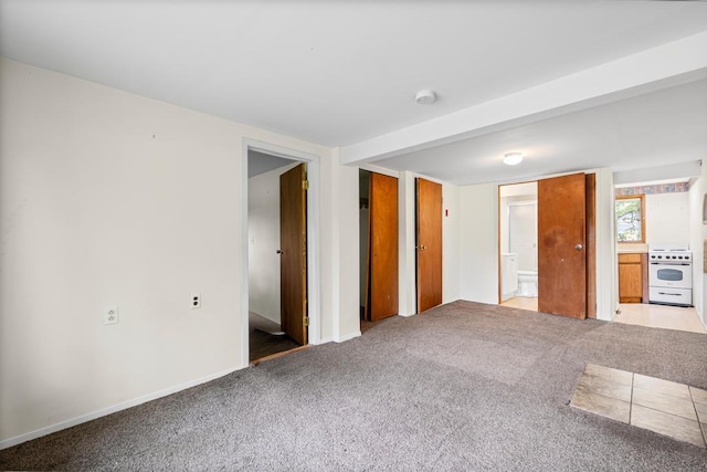1291 Minerva Ave, West Islip, NY 11795 - unfurnished bedroom featuring carpet and connected bathroom