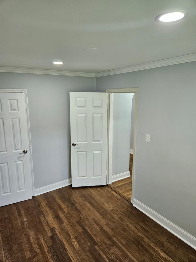 300 Richbell Rd Unit B2, Mamaroneck, NY 10543 - unfurnished bedroom with dark wood-type flooring and ornamental molding