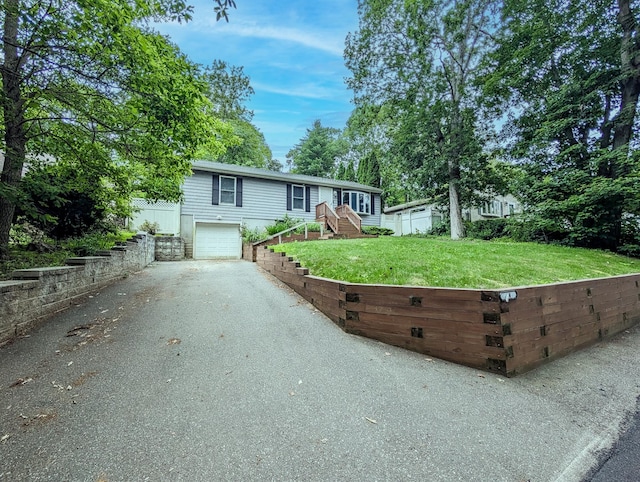 14 Hampton Rd, Sound Beach, NY 11789 - view of front facade with asphalt driveway, an attached garage, and stairway