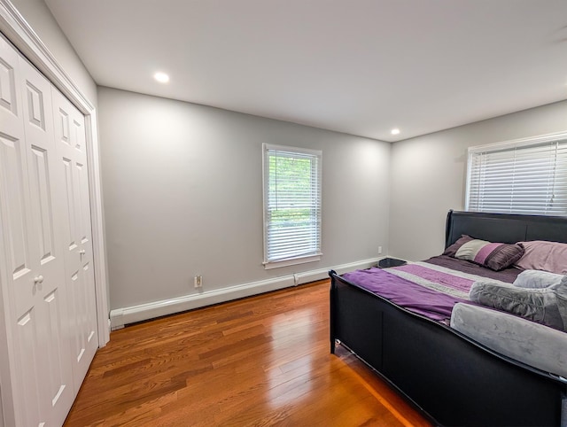 14 Hampton Rd, Sound Beach, NY 11789 - bedroom featuring a baseboard radiator, wood finished floors, recessed lighting, and a closet