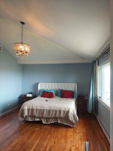 404 Club Ct, Oceanside, NY 11572 - bedroom featuring vaulted ceiling and wood finished floors