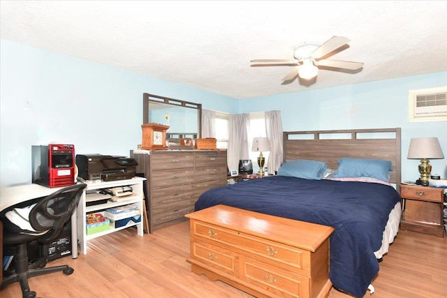 218 Mott St, Oceanside, NY 11572 - bedroom featuring light wood finished floors, a desk, ceiling fan, and a wall mounted AC