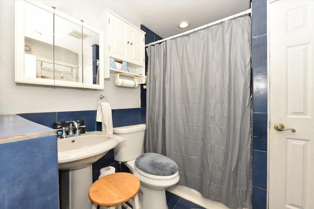 218 Mott St, Oceanside, NY 11572 - full bathroom with toilet and a shower with shower curtain