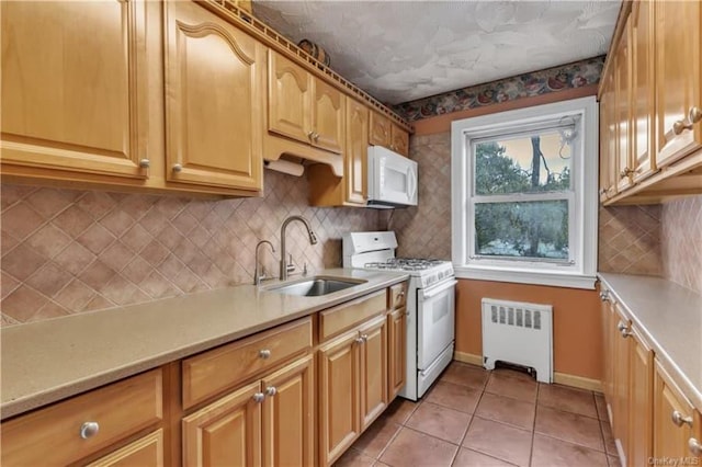 51 White Oak St Unit 2A, New Rochelle, NY 10801 - kitchen with white appliances, radiator heating unit, light tile patterned floors, and light countertops