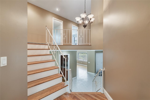 10 Salem Ct, Spring Valley, NY 10977 - stairs featuring a chandelier, wood finished floors, and recessed lighting