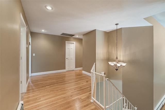 10 Salem Ct, Spring Valley, NY 10977 - hall with an upstairs landing, light wood-style flooring, a chandelier, and recessed lighting
