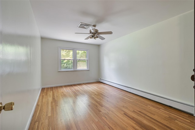 10 Salem Ct, Spring Valley, NY 10977 - unfurnished room featuring a baseboard radiator, wood-type flooring, and ceiling fan
