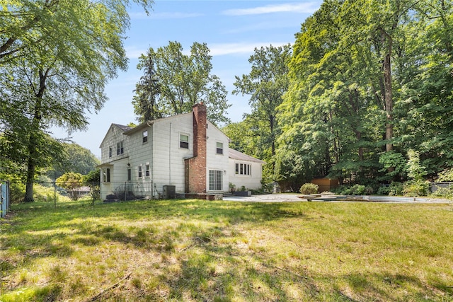 10 Salem Ct, Spring Valley, NY 10977 - view of side of property featuring a chimney and a patio