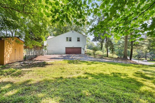 10 Salem Ct, Spring Valley, NY 10977 - view of yard featuring a garage, an outdoor structure, and asphalt driveway