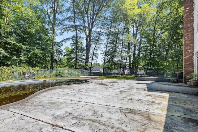 10 Salem Ct, Spring Valley, NY 10977 - fenced backyard featuring a patio area and an empty pool
