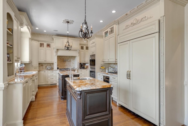 760 Hillcrest Pl, North Woodmere, NY 11581 - kitchen featuring a center island with sink, a chandelier, appliances with stainless steel finishes, recessed lighting, and backsplash