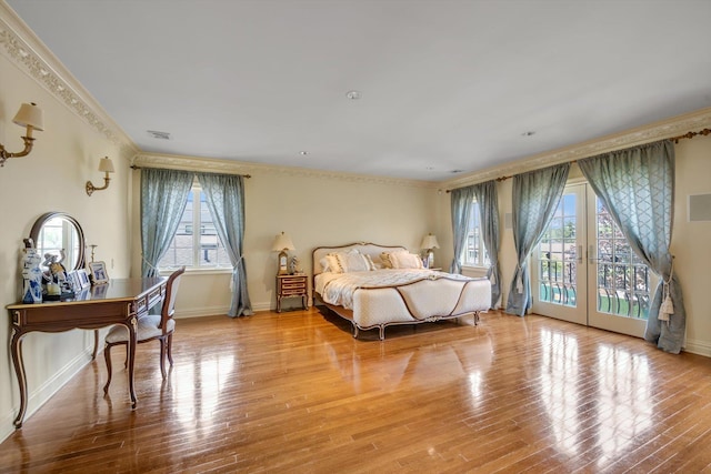 760 Hillcrest Pl, North Woodmere, NY 11581 - bedroom with access to outside, crown molding, and wood finished floors