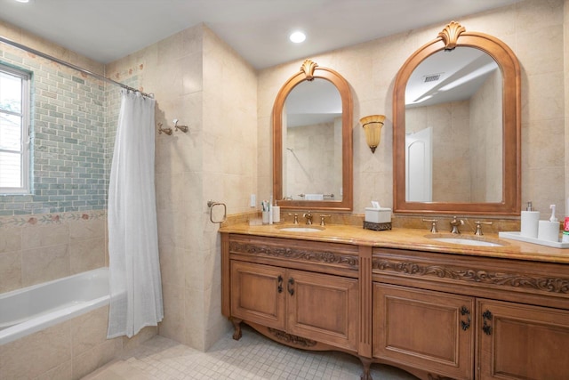 760 Hillcrest Pl, North Woodmere, NY 11581 - bathroom with tile walls, tile patterned floors, double vanity, and tiled shower / bath combo