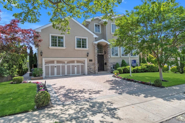 760 Hillcrest Pl, North Woodmere, NY 11581 - traditional-style home with stone siding, stucco siding, a garage, driveway, and a front lawn