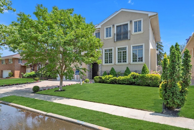 760 Hillcrest Pl, North Woodmere, NY 11581 - view of front of home featuring stucco siding and a front yard