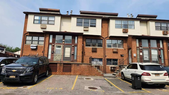 222 Capstan Ct Unit 101B, College Point, NY 11356 - view of property featuring uncovered parking and stairs