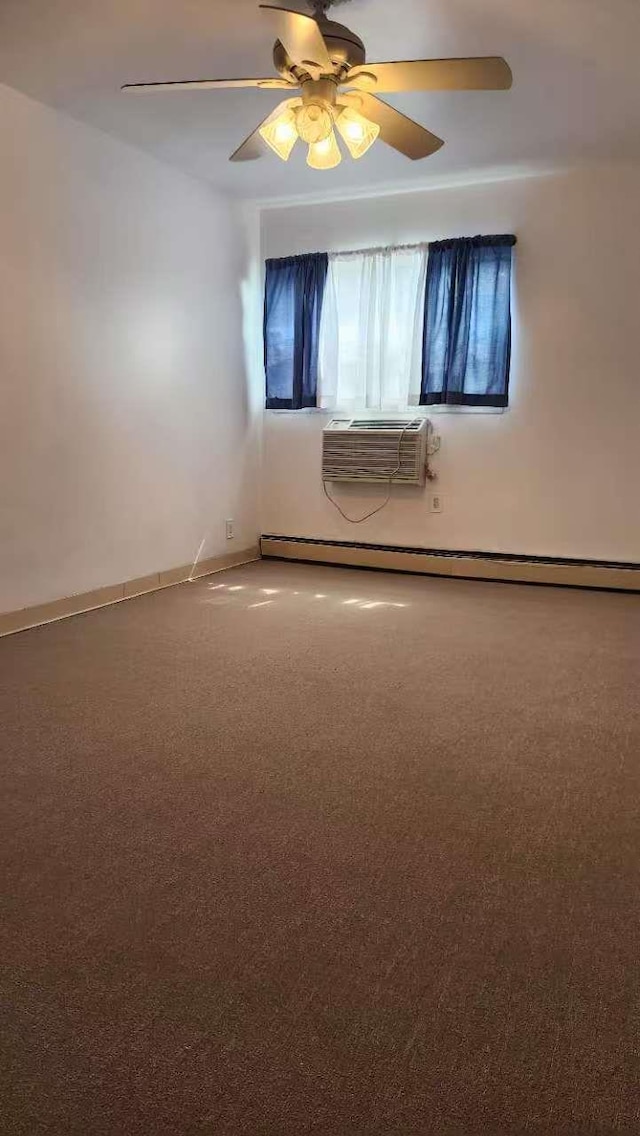 222 Capstan Ct Unit 101B, College Point, NY 11356 - carpeted empty room featuring a wall mounted air conditioner, baseboard heating, and a ceiling fan
