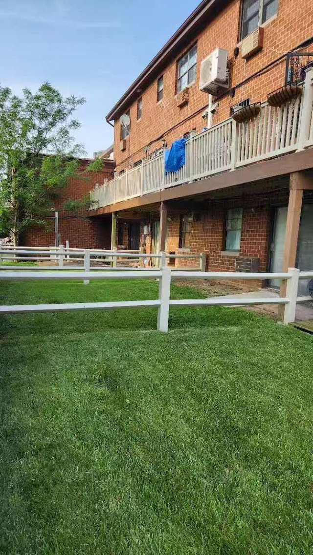 222 Capstan Ct Unit 101B, College Point, NY 11356 - back of house featuring brick siding and a yard