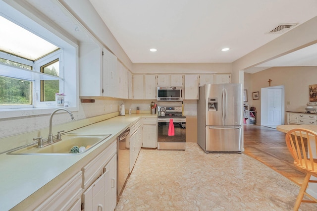 8 Peconic Ln, Selden, NY 11784 - kitchen featuring stainless steel appliances, light countertops, recessed lighting, backsplash, and light floors