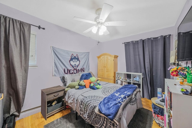 8 Peconic Ln, Selden, NY 11784 - bedroom with light wood-type flooring and a ceiling fan