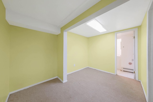 8 Peconic Ln, Selden, NY 11784 - carpeted spare room with a baseboard heating unit and baseboards