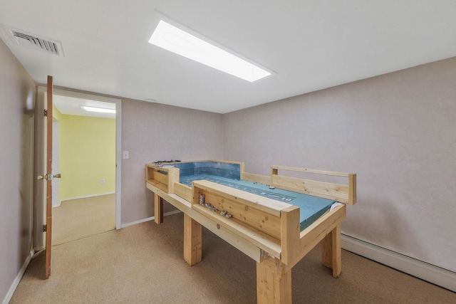 8 Peconic Ln, Selden, NY 11784 - bedroom with a baseboard heating unit and light carpet