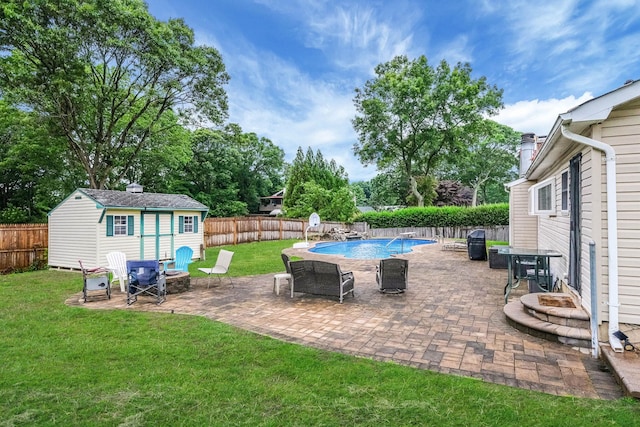 8 Peconic Ln, Selden, NY 11784 - fenced backyard with an outdoor structure and a patio area