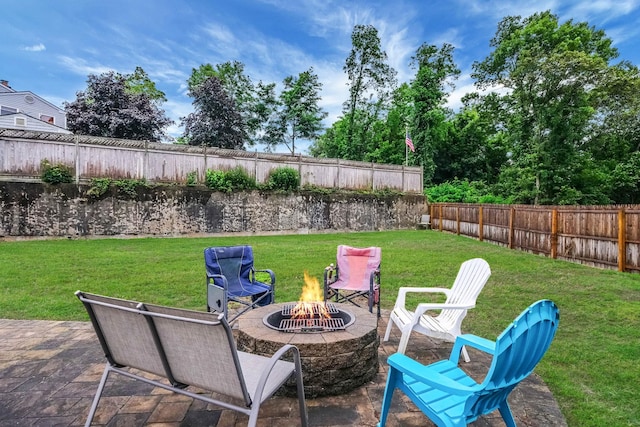 8 Peconic Ln, Selden, NY 11784 - fenced backyard with a fire pit and a patio area