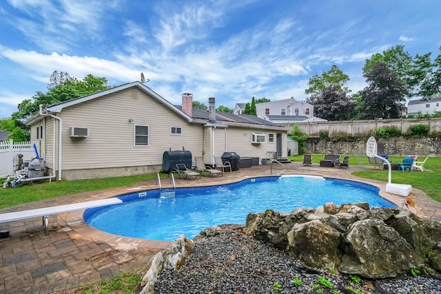 8 Peconic Ln, Selden, NY 11784 - view of pool with a patio area, area for grilling, a diving board, and a wall mounted air conditioner
