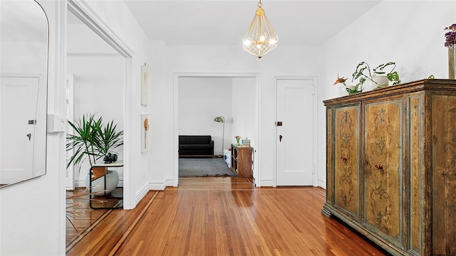 10 Holder Pl Unit 5A, Forest Hills, NY 11375 - foyer entrance featuring hardwood / wood-style floors and a chandelier