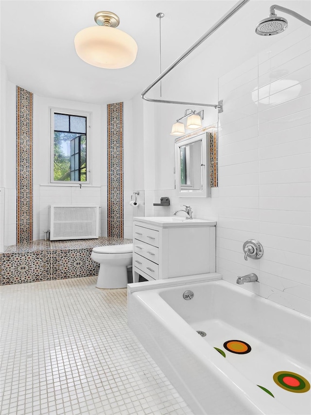 10 Holder Pl Unit 5A, Forest Hills, NY 11375 - bathroom featuring tile walls, tile patterned floors, radiator, vanity, and a wainscoted wall