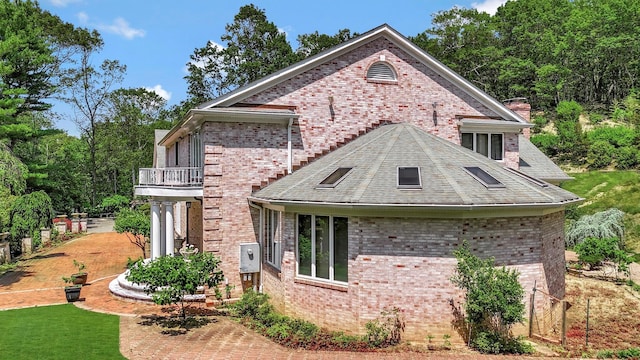 1537 Laurel Hollow Rd, Laurel Hollow, NY 11791 - view of front of property with brick siding, a balcony, and a chimney