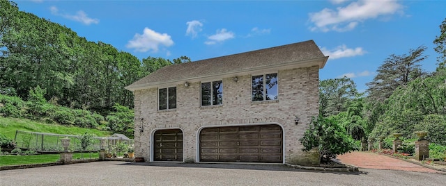 1537 Laurel Hollow Rd, Laurel Hollow, NY 11791 - view of front of home featuring asphalt driveway, an attached garage, and brick siding
