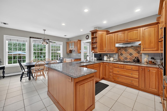 114 Bulsontown Rd, Stony Point, NY 10980 - kitchen with under cabinet range hood, stainless steel gas cooktop, ceiling fan, open shelves, and light tile patterned floors