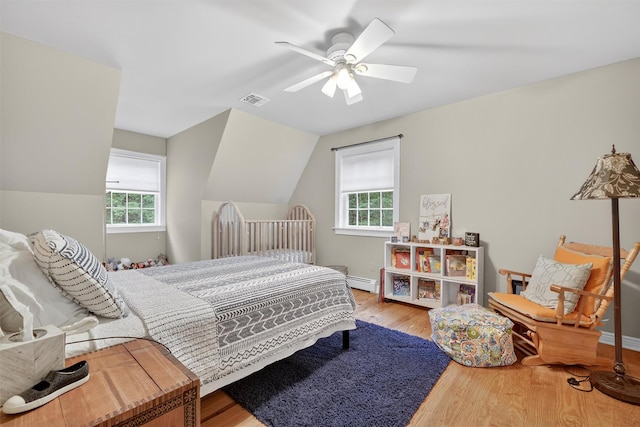 114 Bulsontown Rd, Stony Point, NY 10980 - bedroom featuring wood finished floors, baseboard heating, lofted ceiling, and a ceiling fan