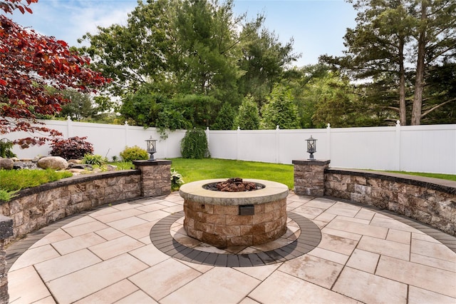 25 Segatogue Ln, South Setauket, NY 11720 - fenced backyard with a patio area and an outdoor fire pit