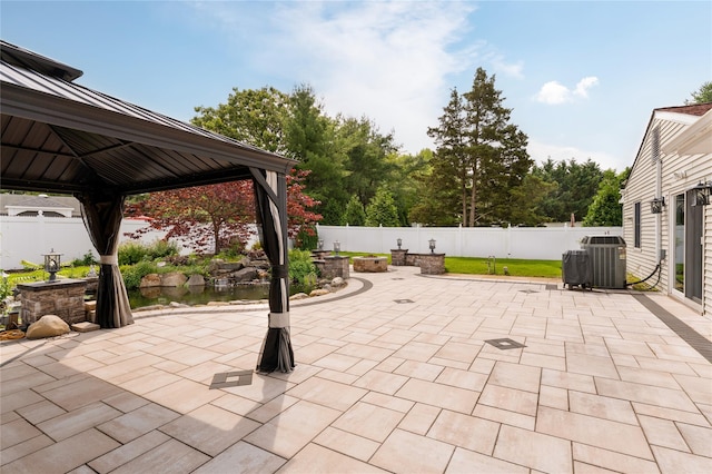 25 Segatogue Ln, South Setauket, NY 11720 - fenced backyard featuring a gazebo and a patio area