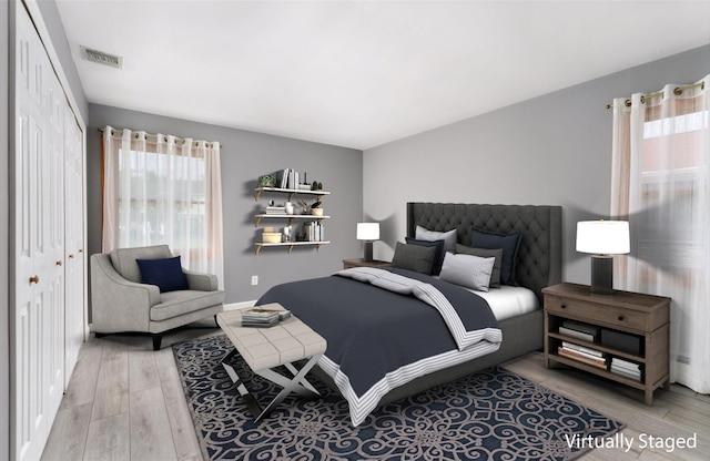 25 Segatogue Ln, South Setauket, NY 11720 - bedroom with light wood-type flooring and a closet