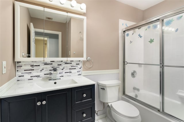 25 Segatogue Ln, South Setauket, NY 11720 - full bath with wainscoting, vanity, combined bath / shower with glass door, and decorative backsplash